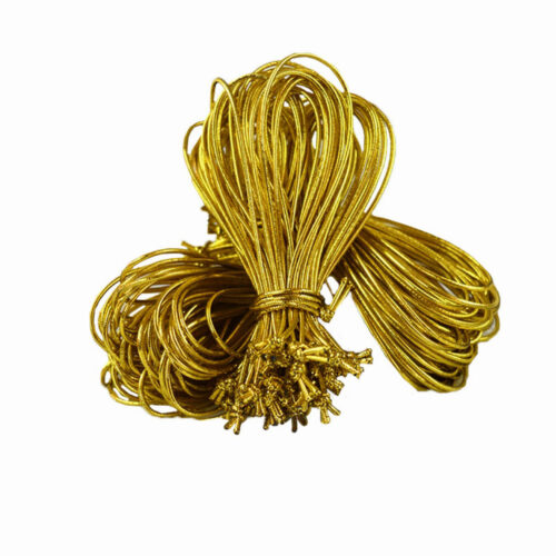 Three bundles of gold elastic cord loops