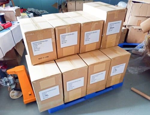 This picture shows boxes filled with bows stacked on a trailer, ready for shipment.