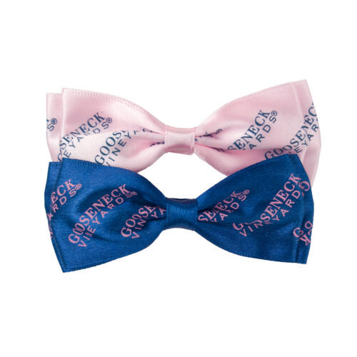 Blue bow tie with pink logo and pink bow tie with blue logo displayed together