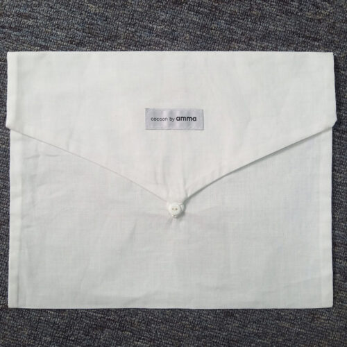 Flat cotton envelope-style storage bag.