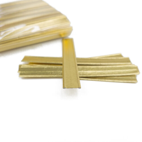 Close-up of a gold double wire twist tie, highlighting its construction with gold-colored paper wrapped around two galvanized iron wires.
