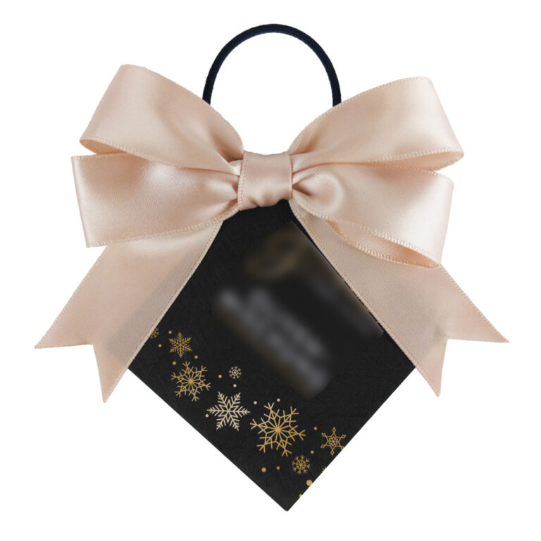 A custom double loop bow in a soft beige color, handcrafted and tailored to client specifications, attached to a black tag adorned with golden snowflakes.