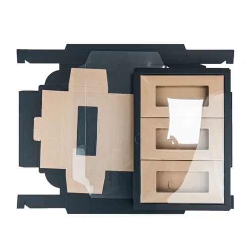 Carton pliable en papier noir et kraft conçu sur mesure avec couvercle en PVC transparent pour l'emballage de chocolat.