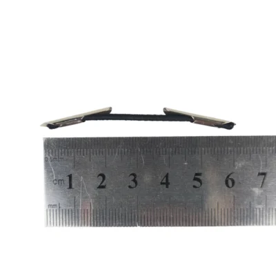 Custom-sized black elastic cord with metal barbed ends for secure fastening, displayed above a metric ruler.