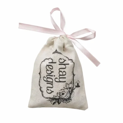 花柄プリントとピンクのリボン留めが付いた、カスタマイズ可能な明るい色の巾着ポーチ。