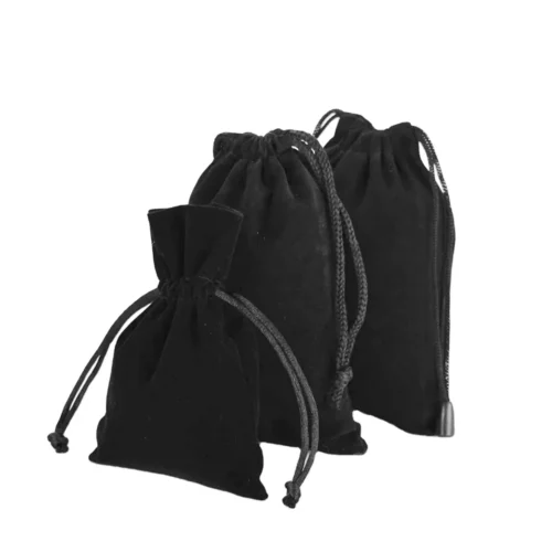 Three custom black velvet drawstring bags in varying sizes, showcasing the soft texture and drawstring closure.