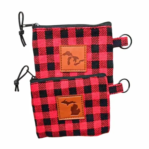 Custom zippered pouches featuring a leather patch, showcasing a vibrant checkered pattern.