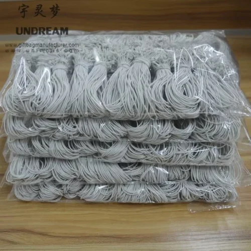 Benutzerdefinierte elastische Schnurschlaufen in gebündelter Verpackung für Etiketten und Produktbündelung; langlebig und in verschiedenen Farben/Größen erhältlich.