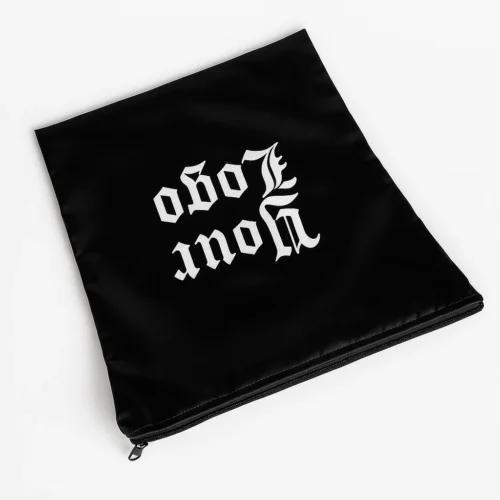 Angled black cap zipper bag sample showing smooth surface and zipper closure Title: Angled cap zipper bag sample