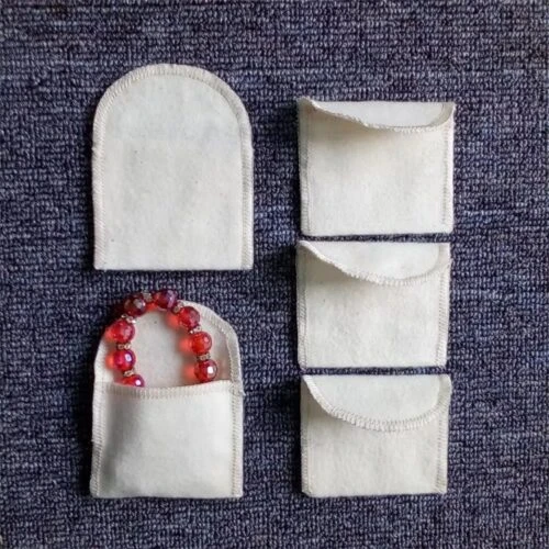 Custom napped envelope pouch made of 100% cotton peach skin for scratch-free jewelry packaging.