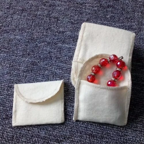 Custom napped envelope pouch made of 100% cotton peach skin for scratch-free jewelry packaging.