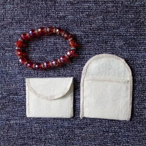 Custom napped envelope pouch made of 100% cotton peach skin for scratch-free jewelry packaging.