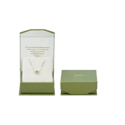 Closed and open views of custom-made magnetic flip top jewelry boxes in green.