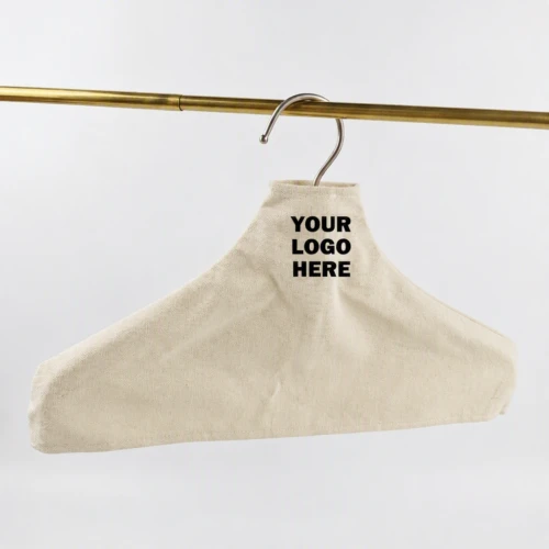 Natural cotton Custom Fabric Hanger Covers with printed logo space, hanging on a gold rail