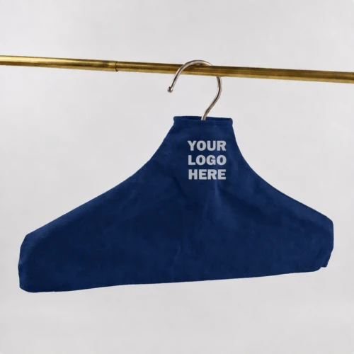 Navy blue Custom Fabric Hanger Covers on a gold garment rail in a retail display setting