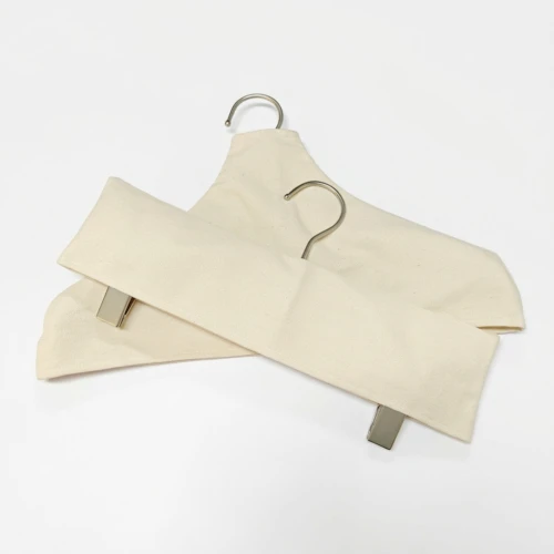 Two off-white Custom Fabric Hanger Covers stacked flat, showing bulk order packing